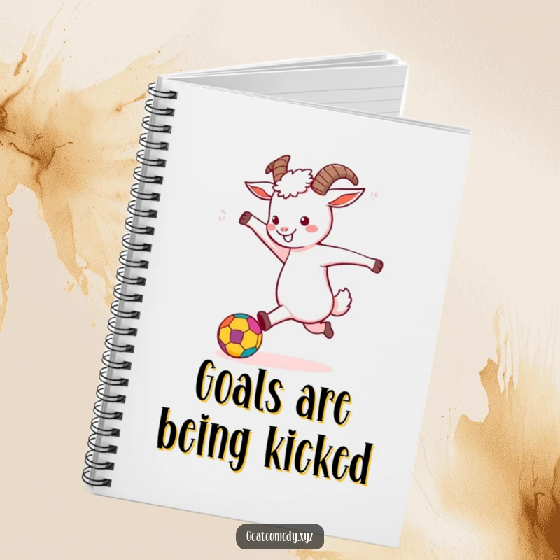 Funny Goat Notebook with a goat energetically kicking a colorful ball, ideal for writing and creative notes.